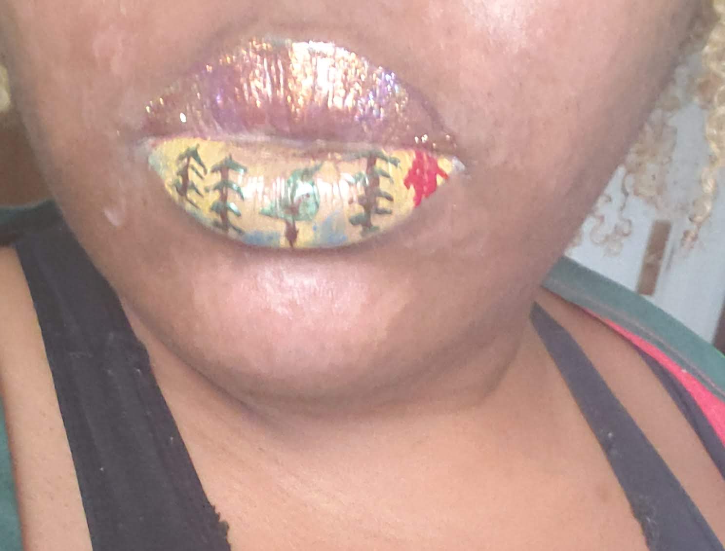 Close-up of lips covered in multicolor jewel mosaic with gold accents
