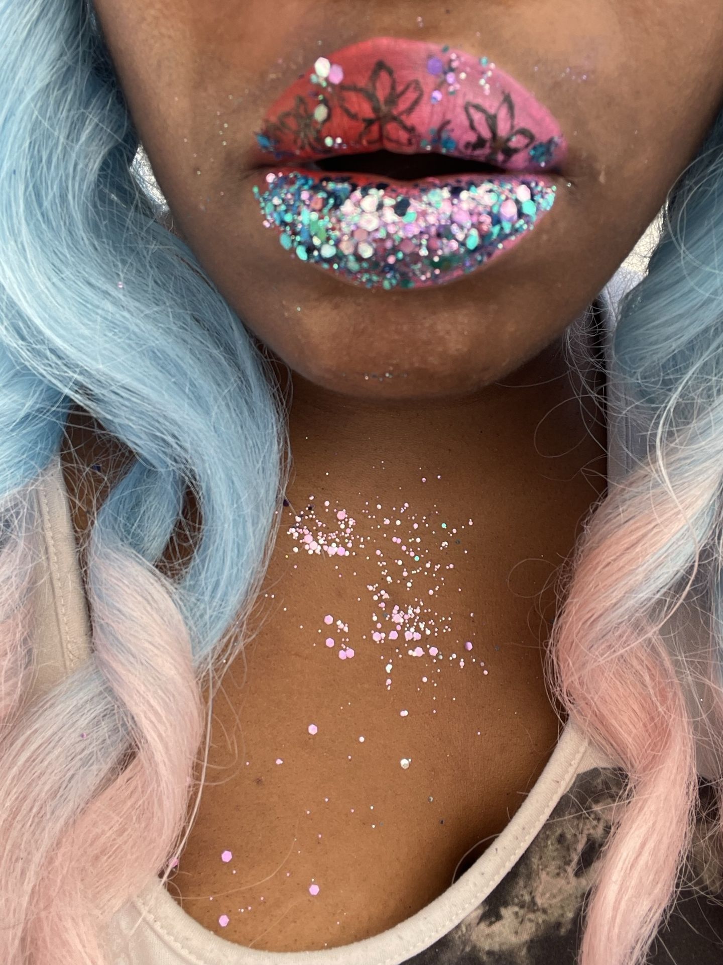Black woman with silver and multicolor crystal lip art, close-up portrait showcasing jeweled texture and high-shine editorial makeup