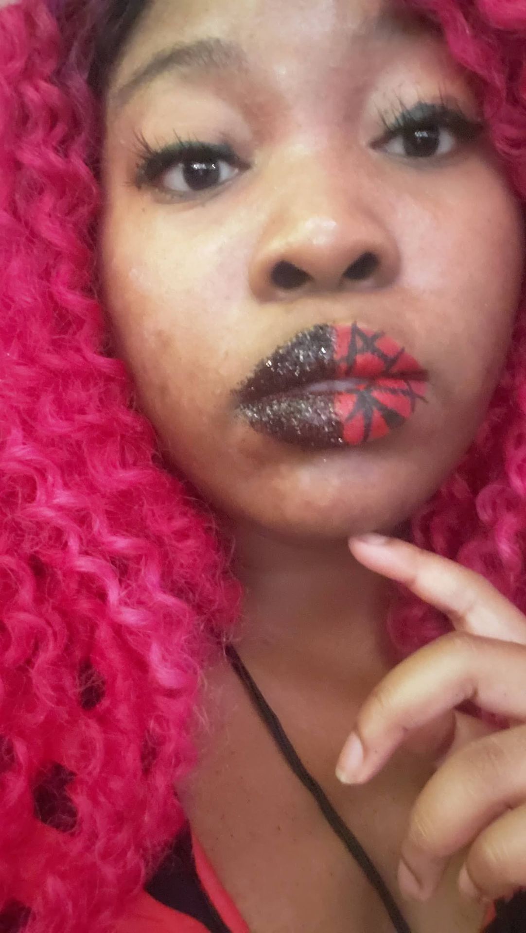 Woman with pink curls and soft rose crystal lip accents