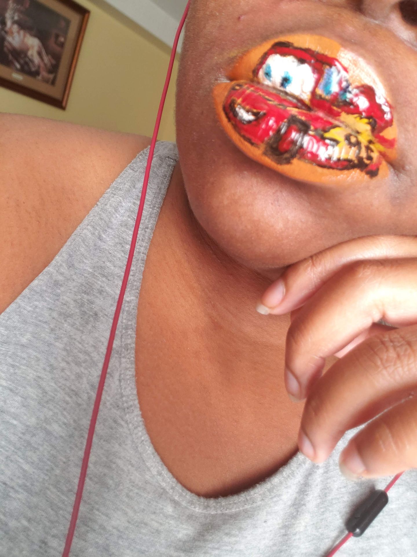 Close-up of lips with multicolor candy-style rhinestone mosaic