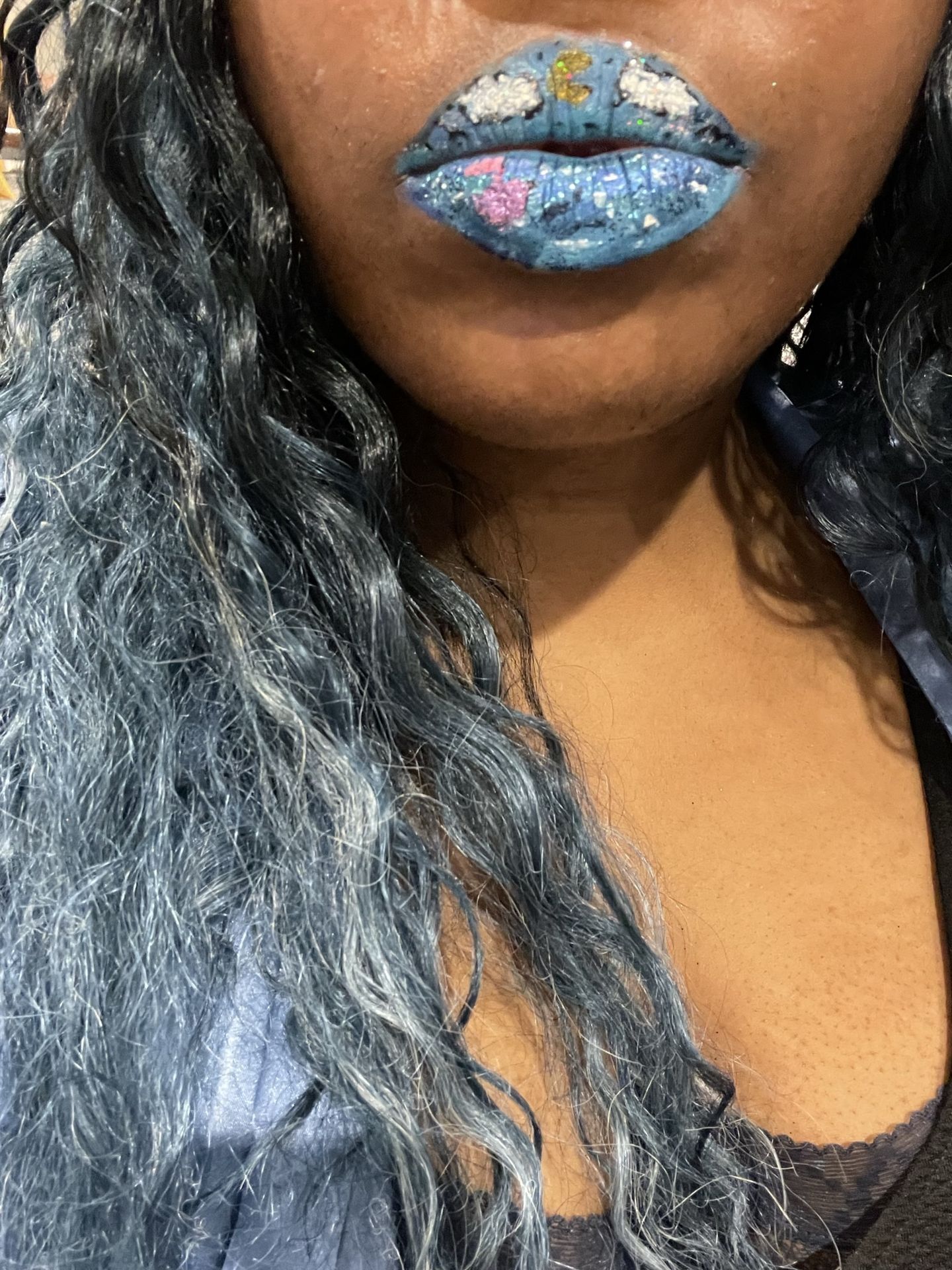 “Close-up of woman with long black hair and natural makeup.”