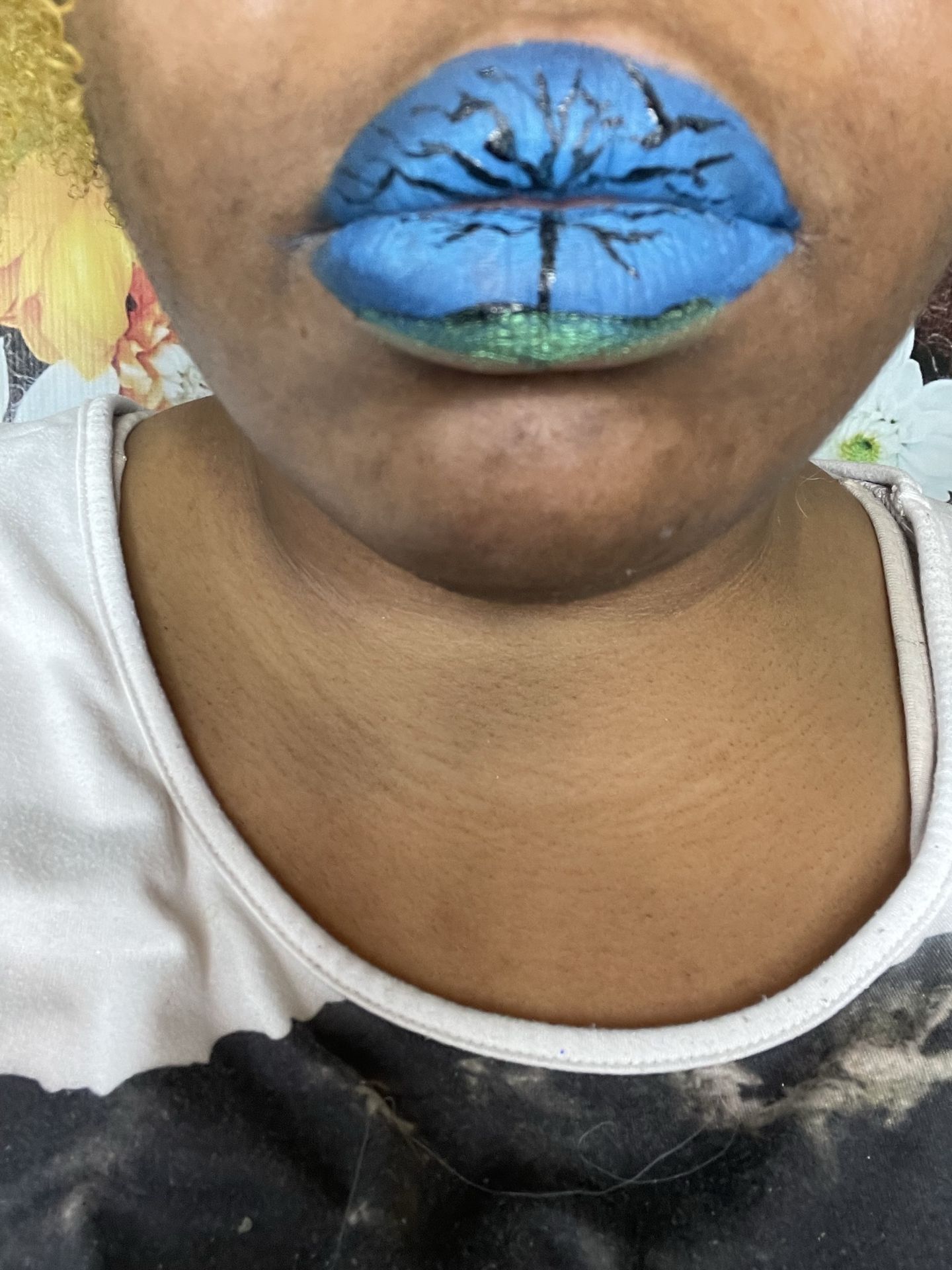 Close-up of sky-blue matte lipstick with clean lip outline