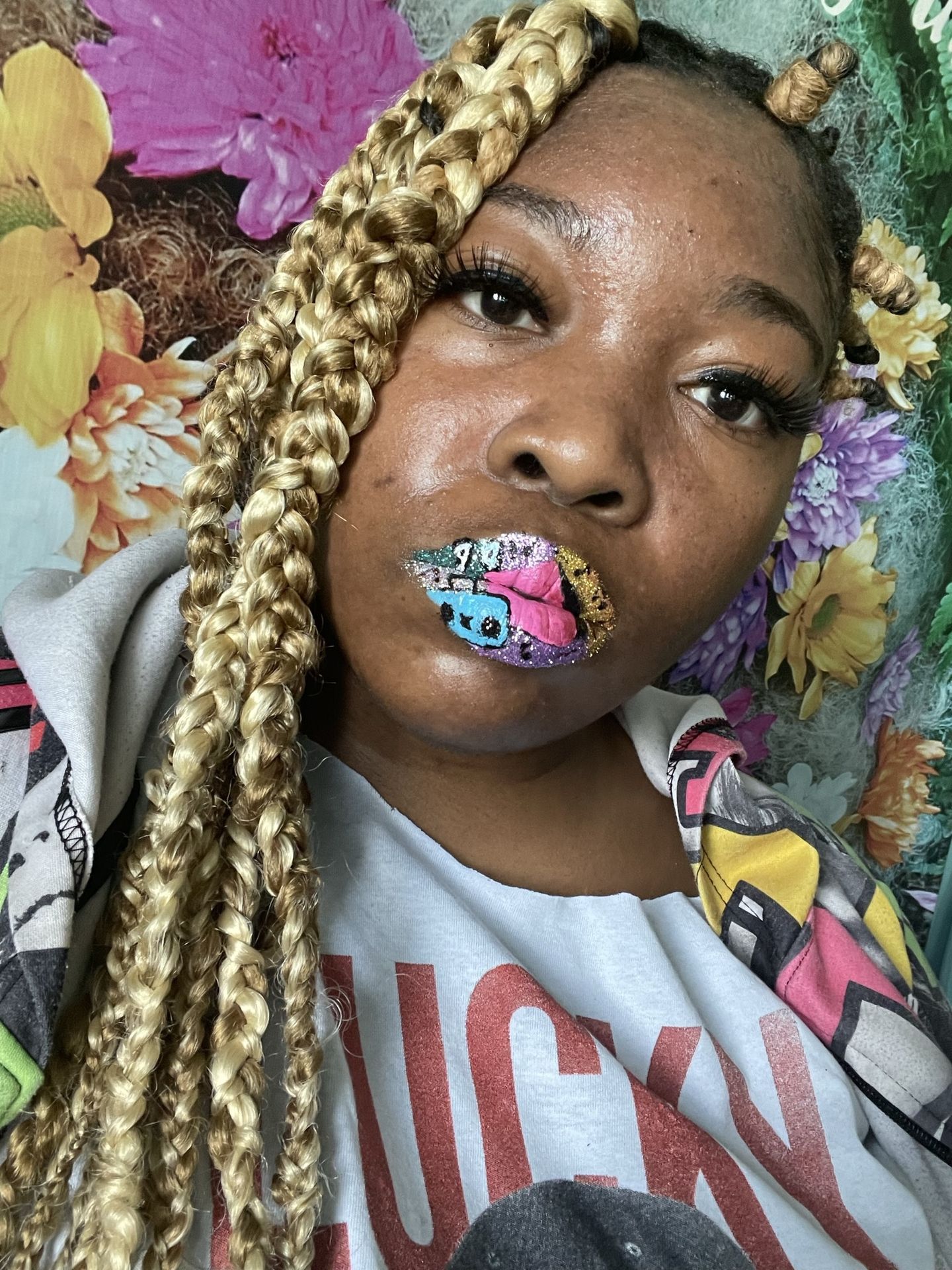 “Portrait of woman with dramatic eye makeup and crystal lip art.”