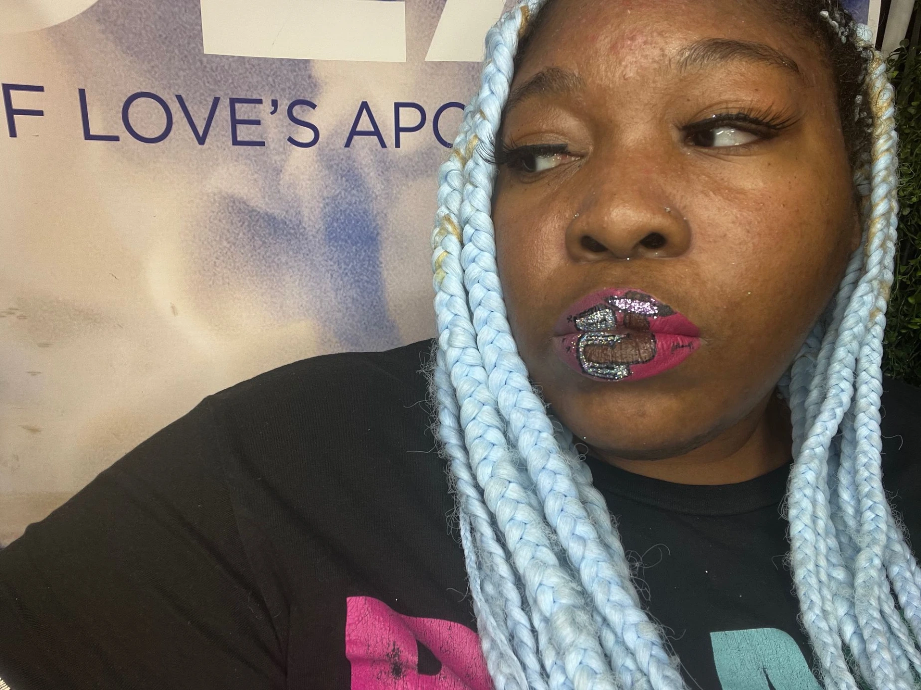 Woman with silver-blue hair and glossy crimson lip color