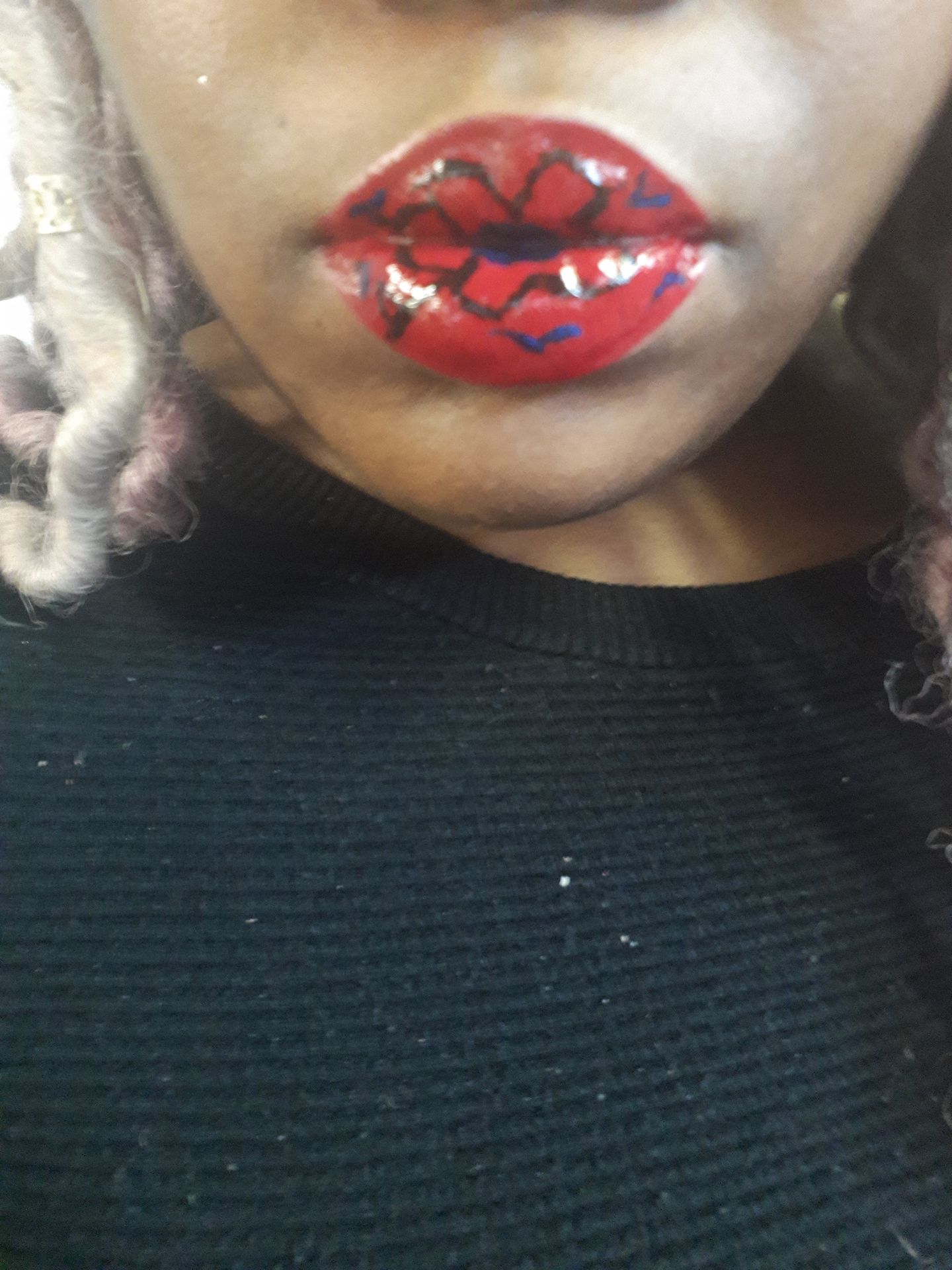 Close-up of classic red lipstick with high-shine finish