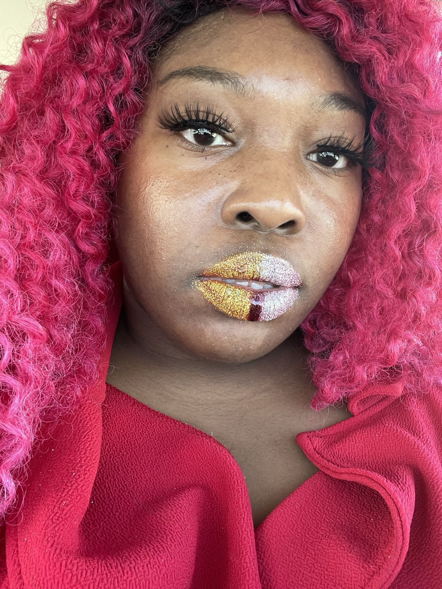 Black woman with red curls and pearl-white crystal lips