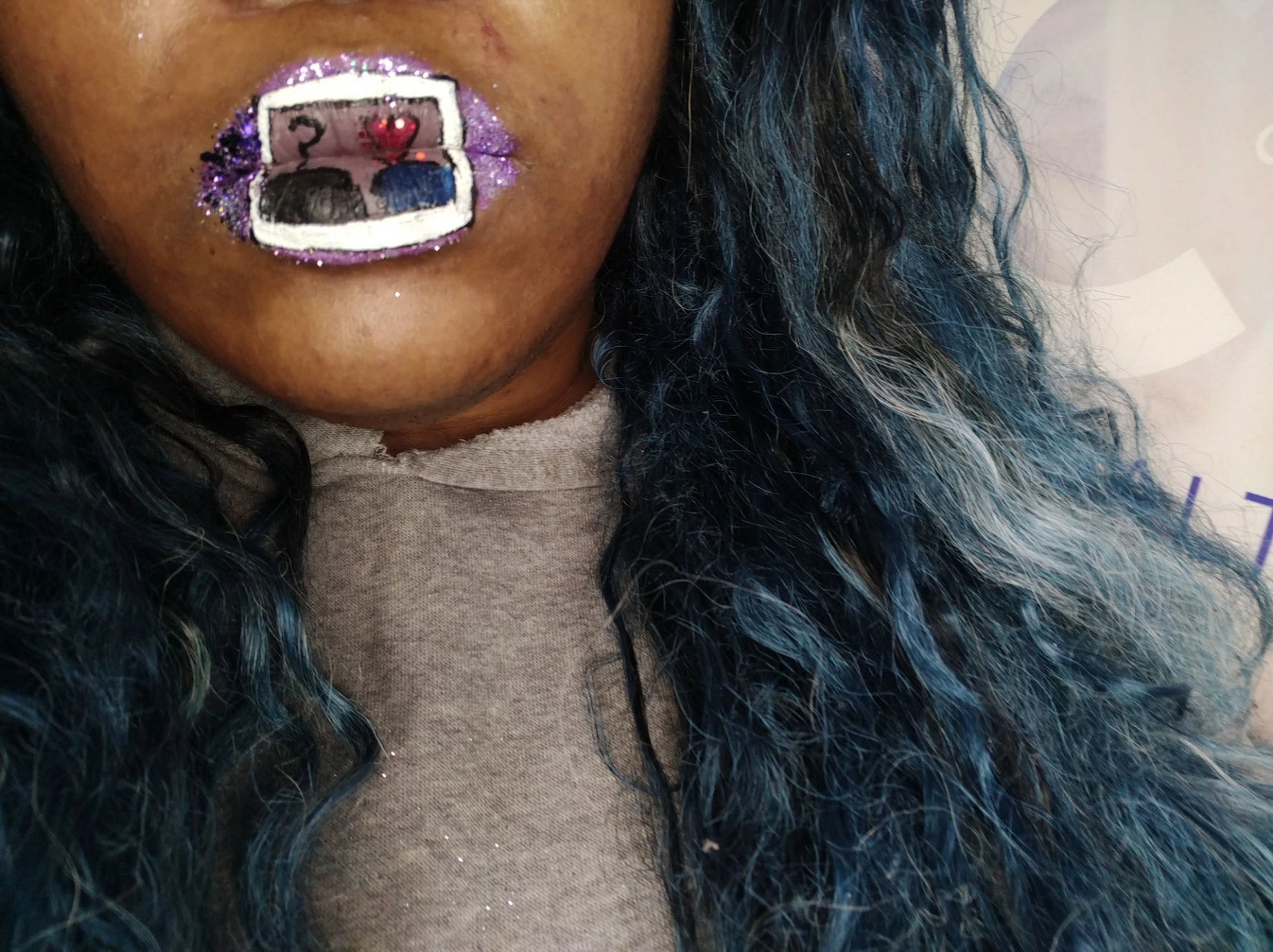 Woman with long black hair wearing glossy dark copper lipstick