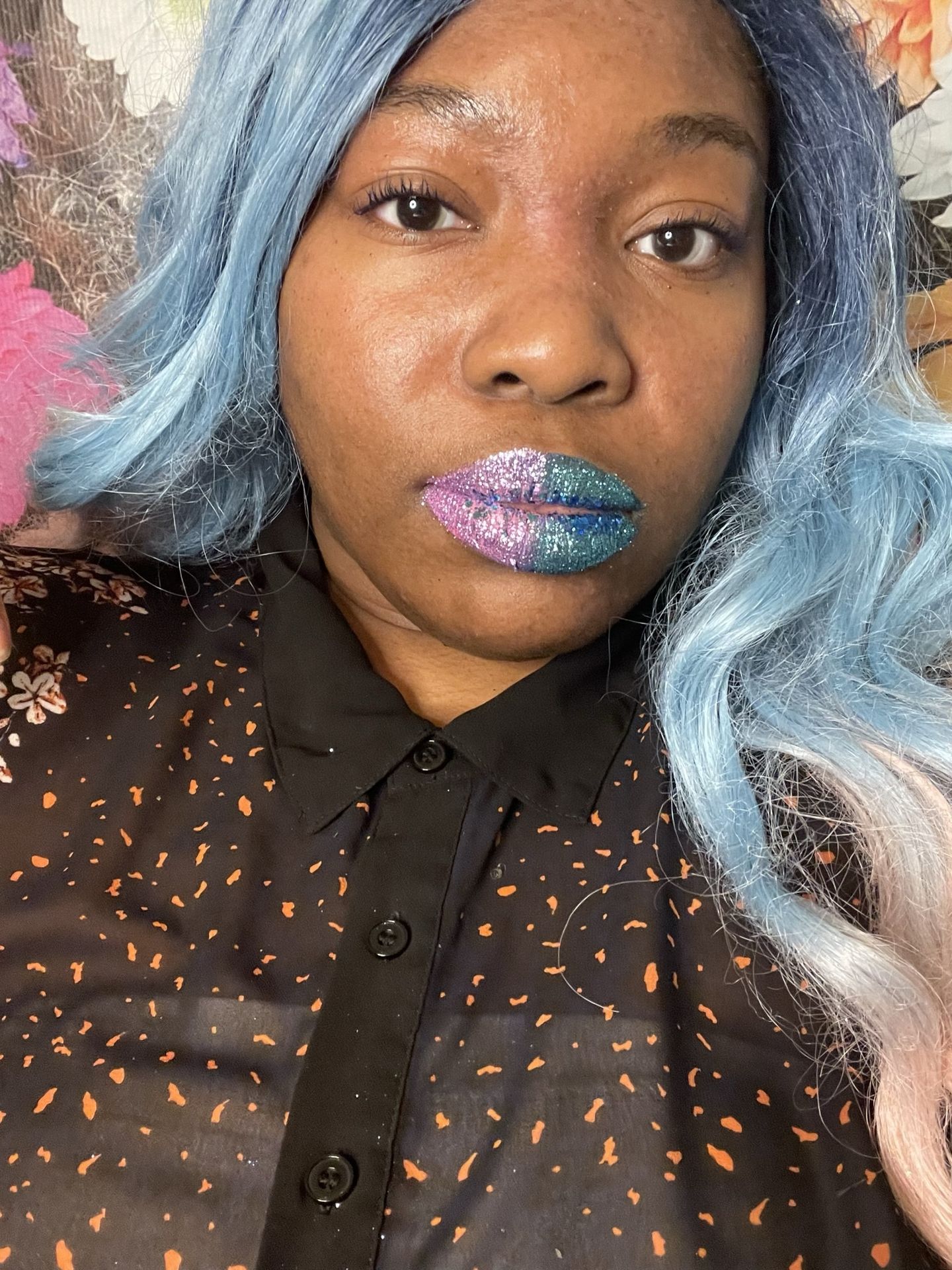 Woman with icy blue waves and scattered crystal lip accents