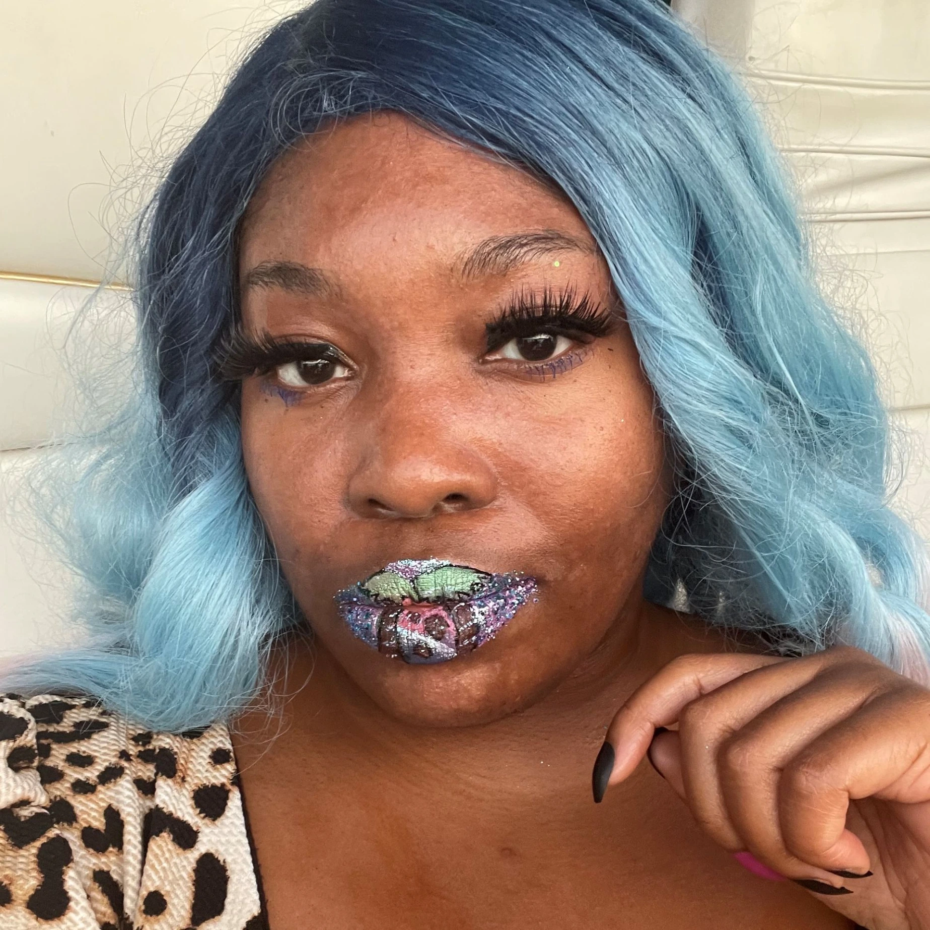 Black woman with teal ombré hair and glossy aqua glitter lips, modern editorial beauty image.