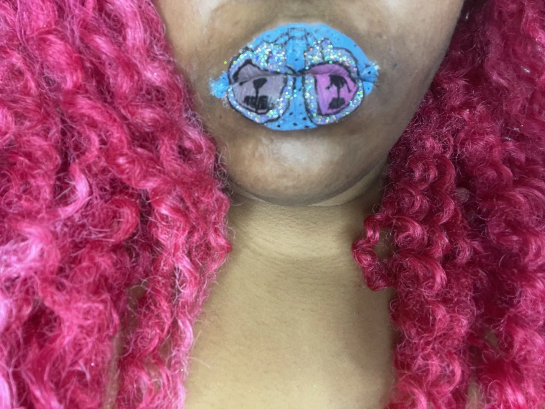 Close-up of lavender-blue crystal lips with reflective shine