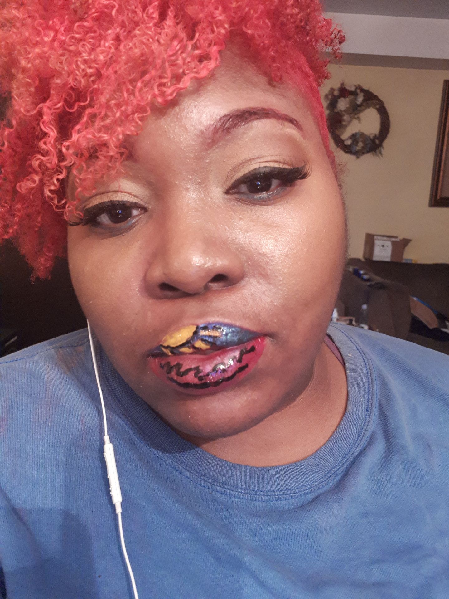 Woman with short red hair wearing deep berry satin lipstick