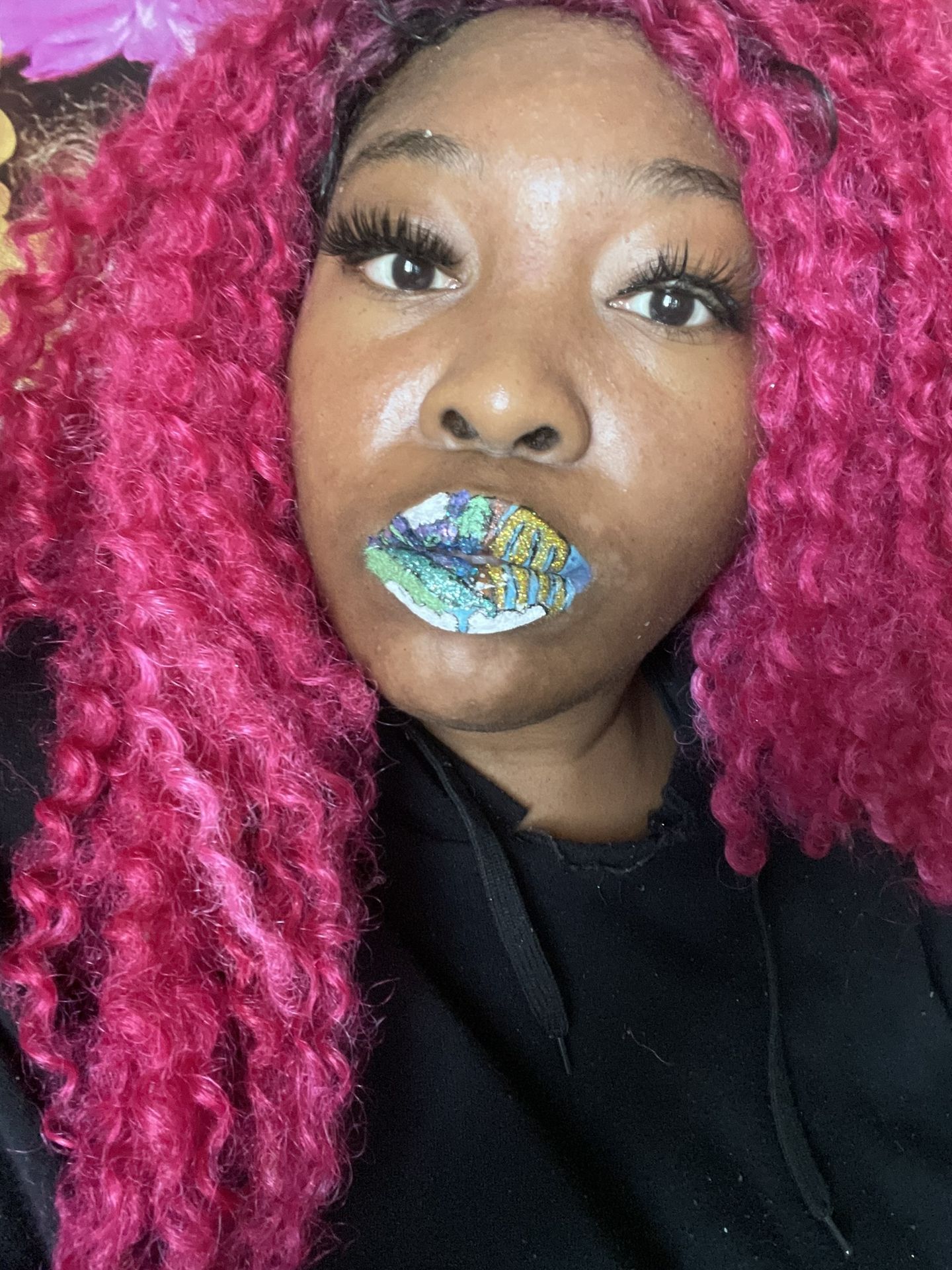 Woman with magenta curls wearing aqua rhinestone lip accents