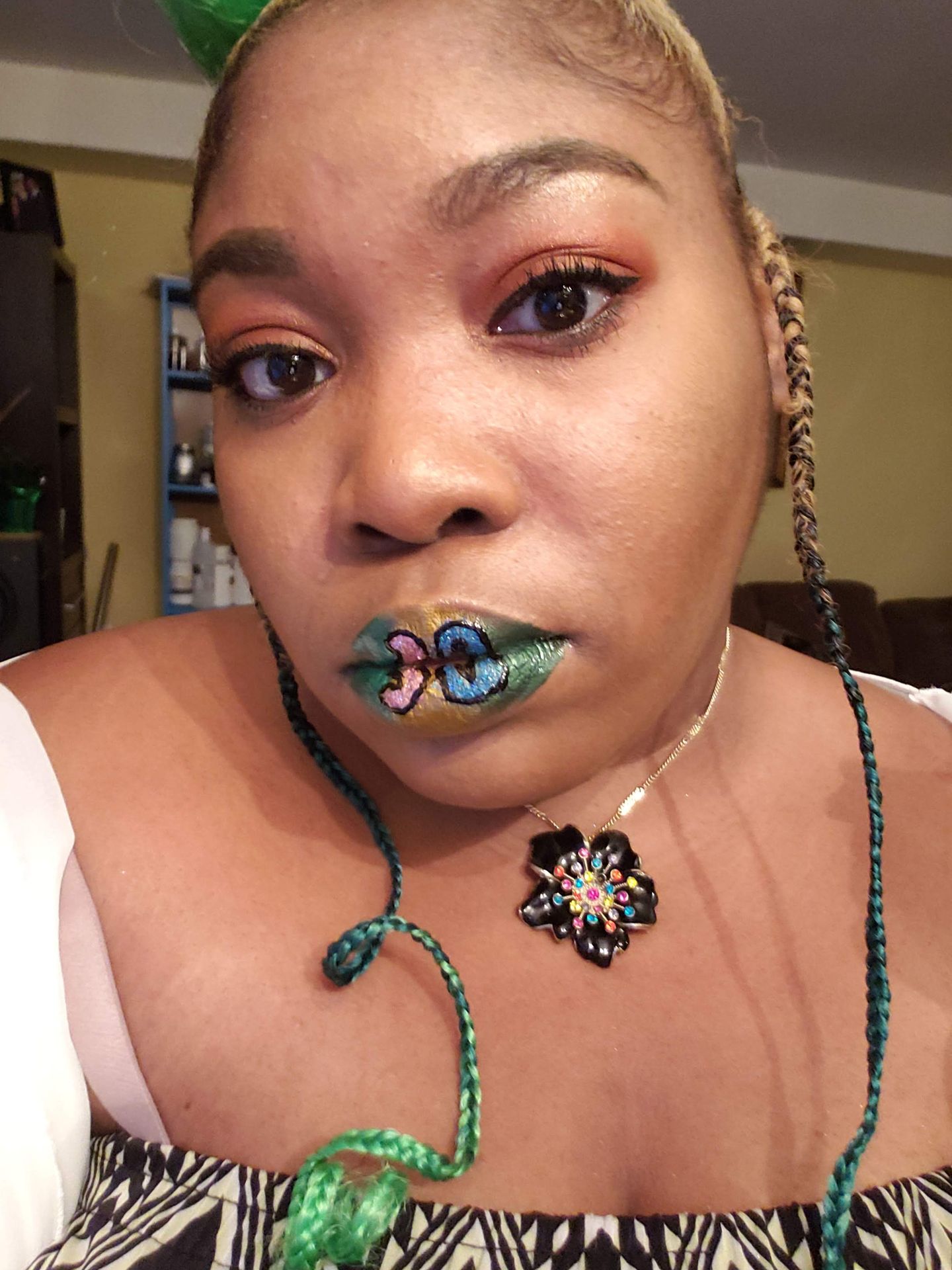 Woman with copper curls and layered turquoise gemstone lips