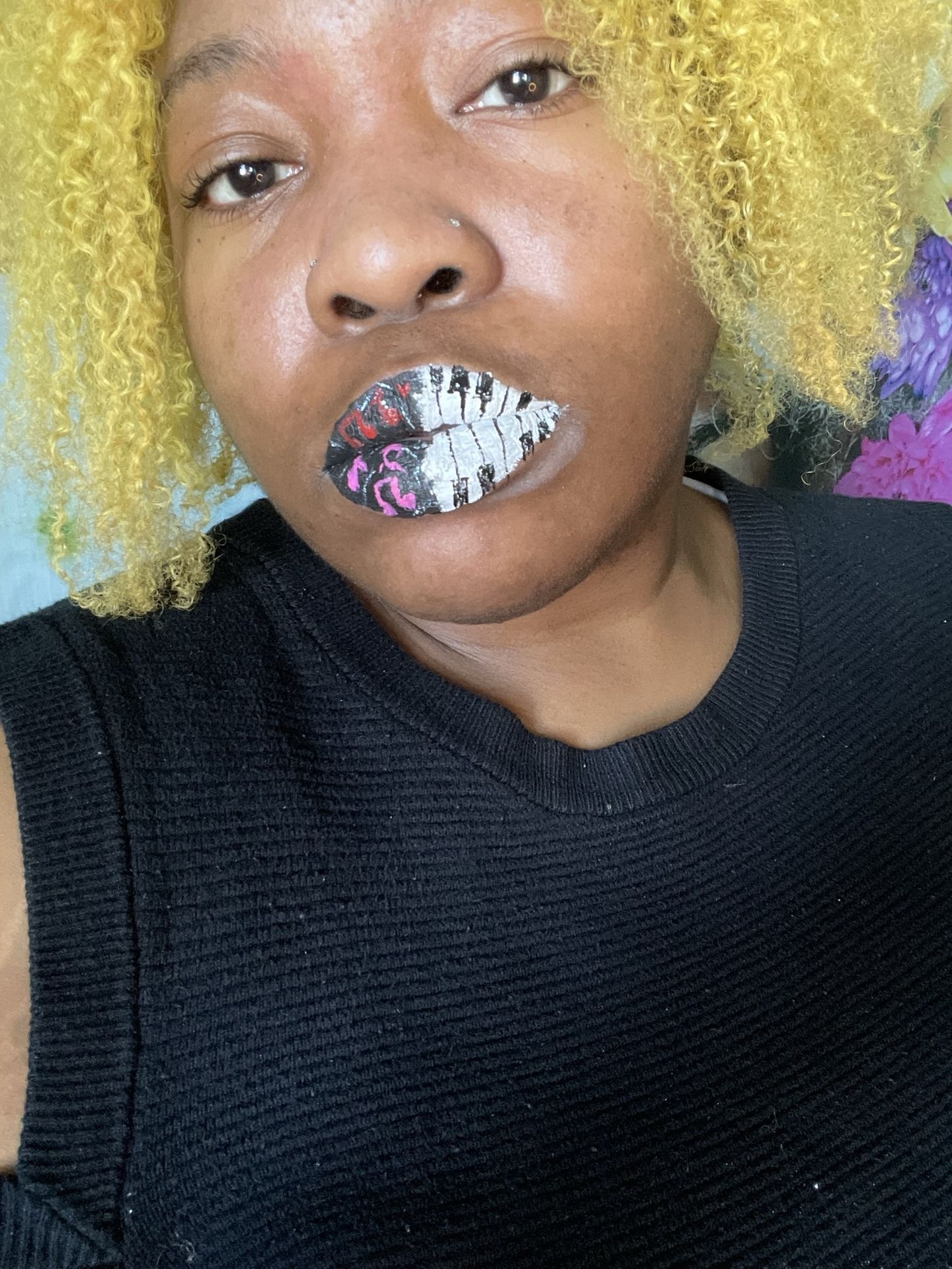 Woman with short golden curls wearing white pearl-textured lip art