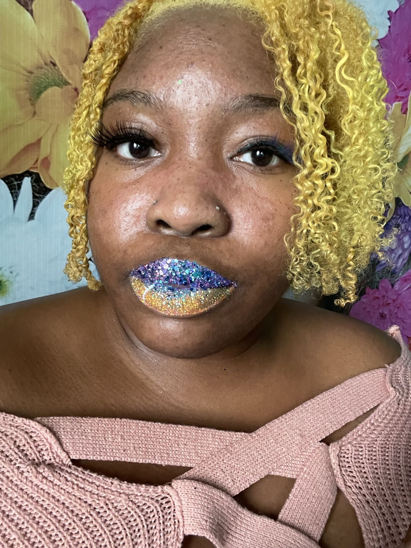 Woman with golden curls and cobalt blue foil-style lips