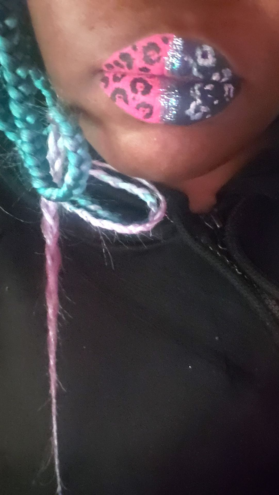 Side view of metallic turquoise lips with reflective gloss finish