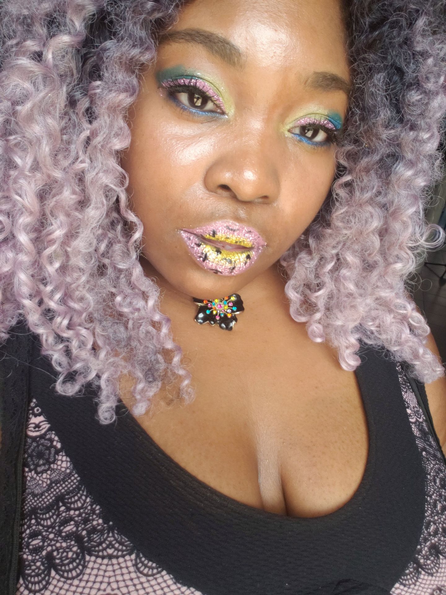 Black woman with lavender curls wearing pearl and crystal lip accents