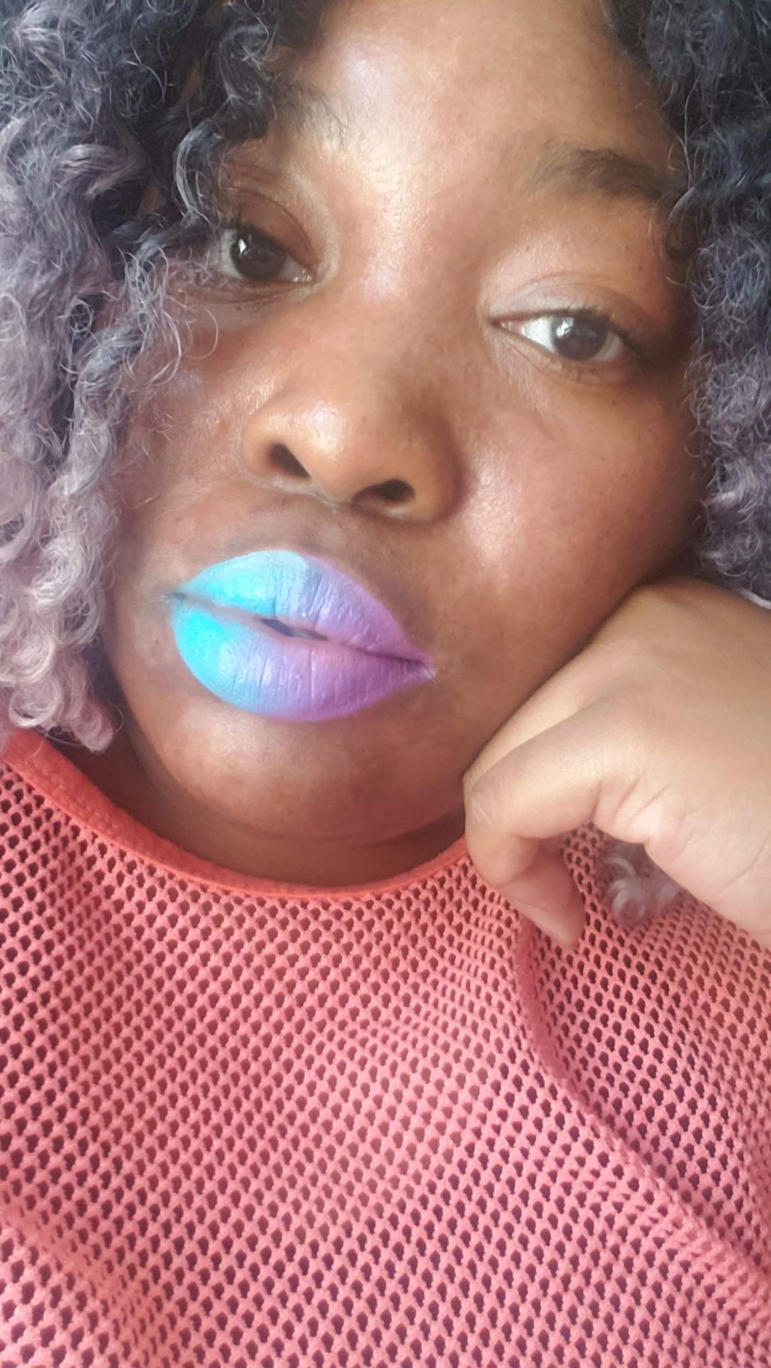 Close-up of iridescent pastel chrome lipstick with soft shimmer