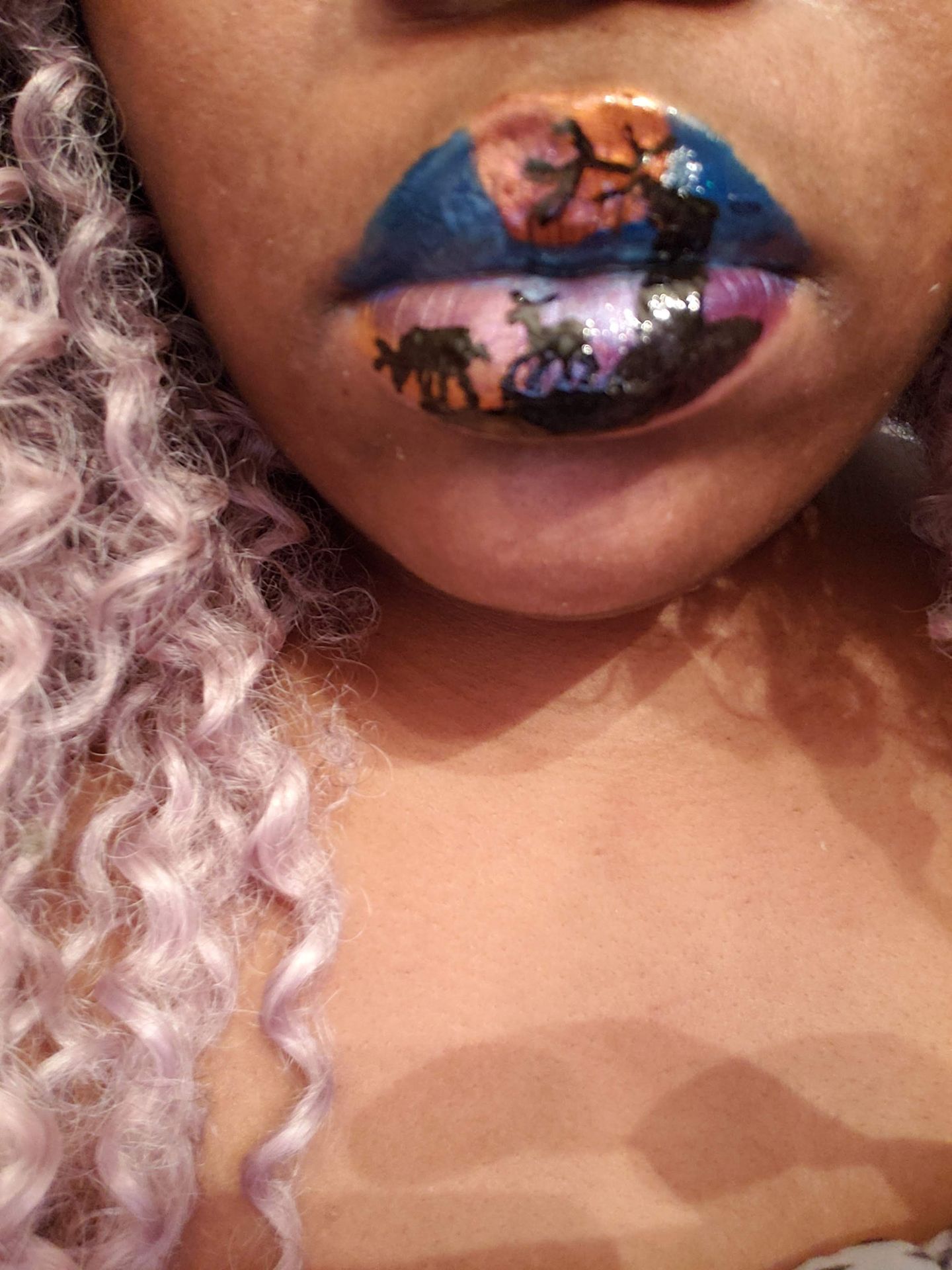 Black woman with natural afro and multicolor sequin lip art, expressive close-up beauty image.